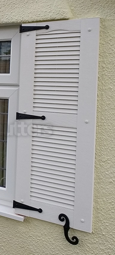 white louvre shutter with decorative hinges 