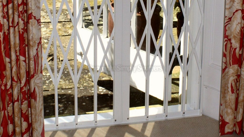 bottom of closed security grille on door 