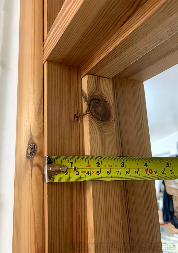 CU door frame with tape measure against it 