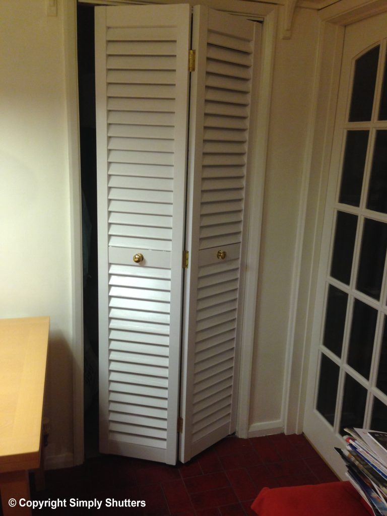 white painted wooden louvre cupboard door 