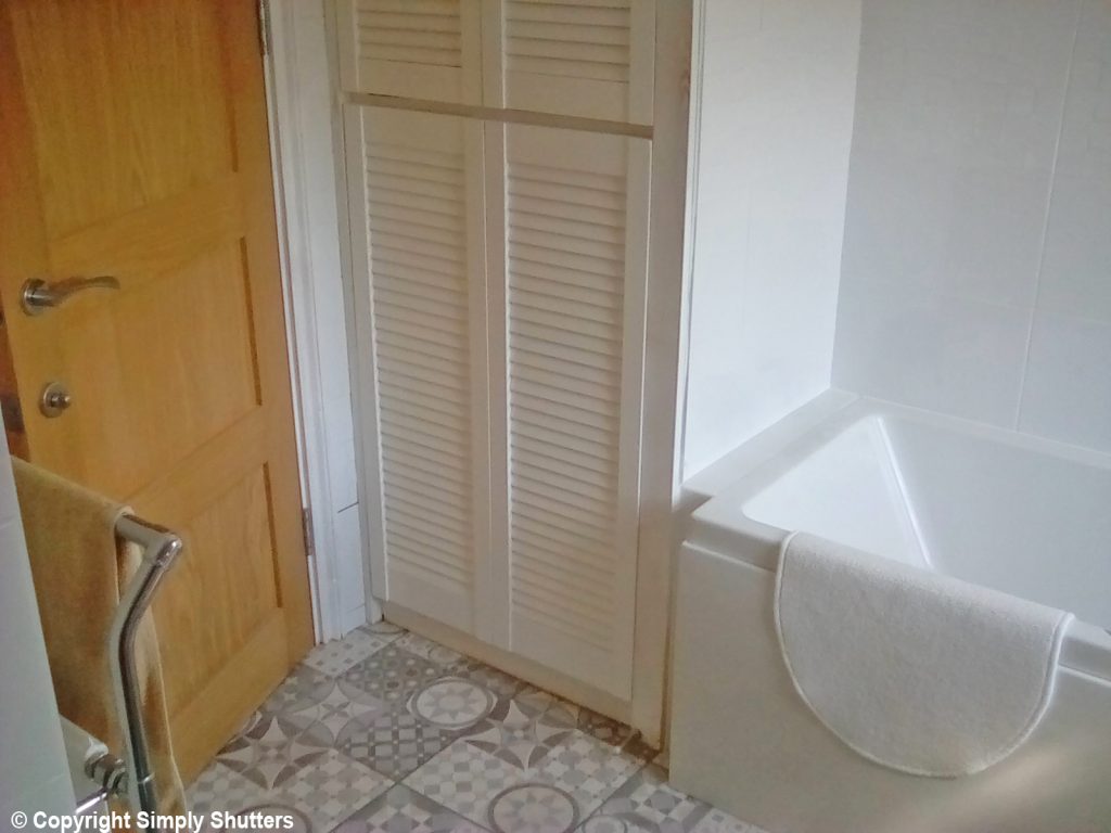 white louvre door on bathroom cupboard 
