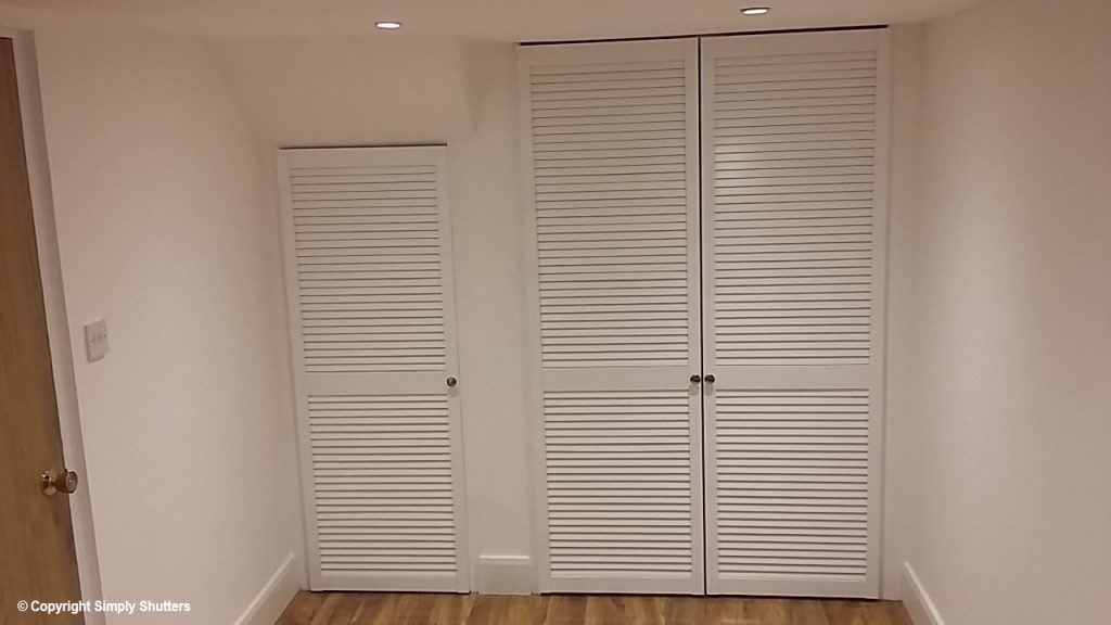 white louvre doors over cupboard opening