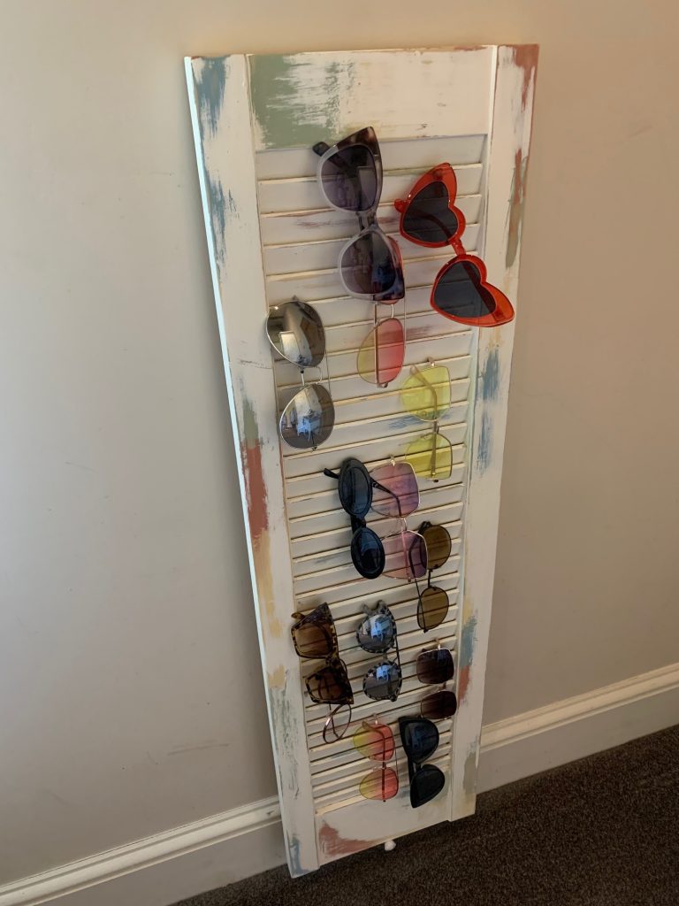 sunglasses displayed on an upcycled louvre door