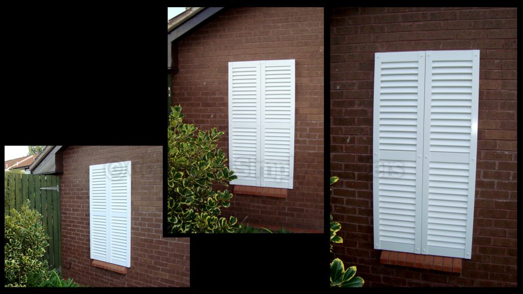 Using decorative shutters as a window covering.