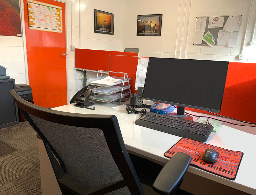 office desk with orange accents and door