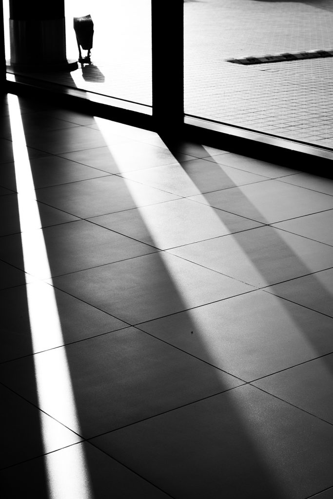 sun shining through window on tiled floor 