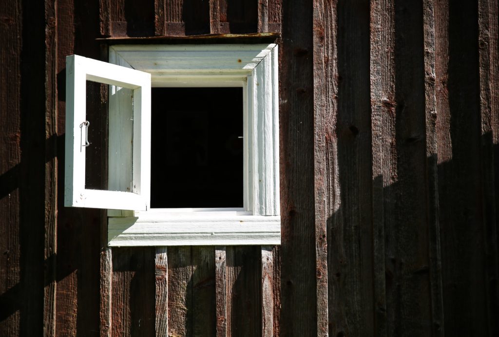 Close up of open window with white frame