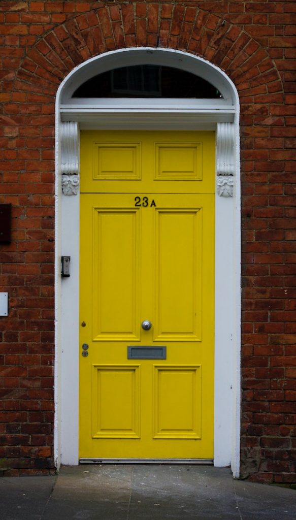 Front door painted bright yellow 