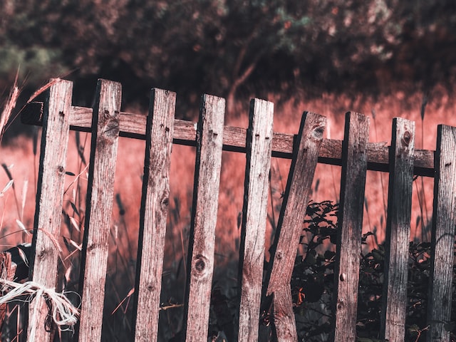 wooden fence with broken picket 