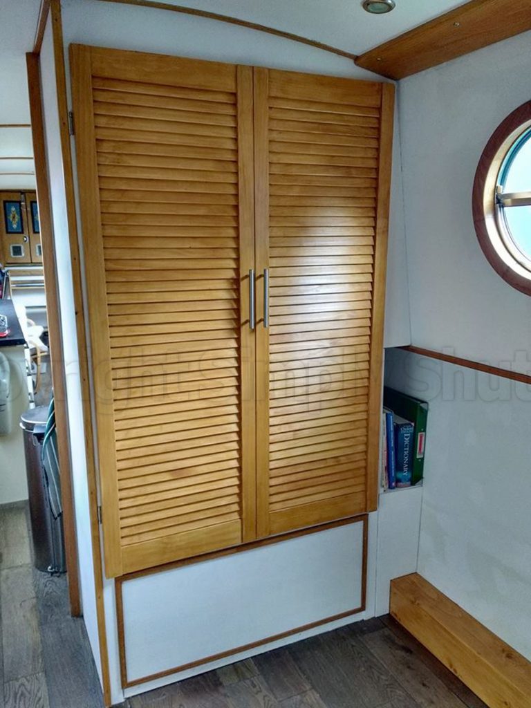 Louvre door installed on cupboard on a boat